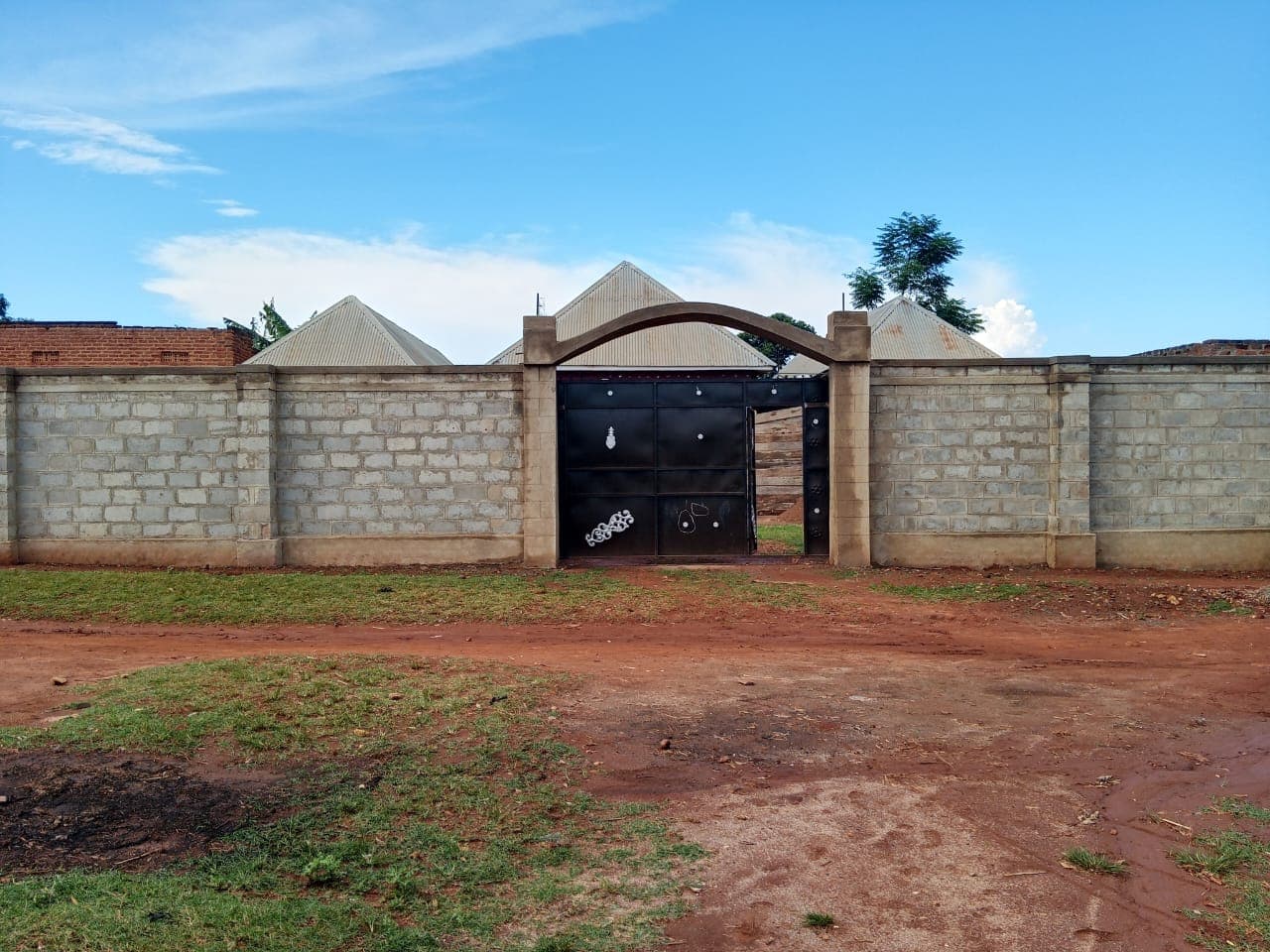 Secure stone-walled compound with a private gated entrance
